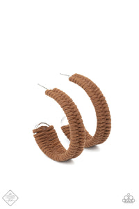 Brown suede cording crisscrosses around a layered silver frame that widens as it curves into a simple hoop, creating a textured handcrafted design. Hoop measures approximately 2" in diameter. Earring attaches to a standard post fitting.  Sold as one pair of hoop earrings.