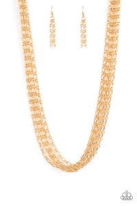 Layer after layer of edgy gold chains drape across the chest, creating an intense industrial display. Features an adjustable clasp closure.