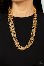 Load image into Gallery viewer, Layer after layer of edgy gold chains drape across the chest, creating an intense industrial display. Features an adjustable clasp closure.
