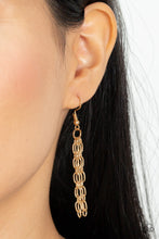 Load image into Gallery viewer, Layer after layer of edgy gold chains drape across the chest, creating an intense industrial display. Features an adjustable clasp closure.
