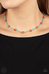 A dainty strand of turquoise seed beads is dotted with red and yellow beaded floral frames, creating a flirtatious floral look around the neck. Features an adjustable clasp closure. 