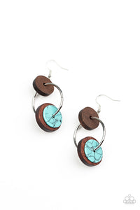 An earthy collection of brown wood and turquoise stone discs are threaded along a silver hoop, linking into a trendy lure for an artisan inspired fashion. Earring attaches to a standard fishhook fitting. 