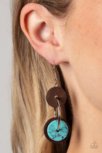 Load image into Gallery viewer, An earthy collection of brown wood and turquoise stone discs are threaded along a silver hoop, linking into a trendy lure for an artisan inspired fashion. Earring attaches to a standard fishhook fitting. 
