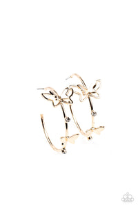 A pair of dainty gold butterflies flutter atop a glistening gold hoop dotted with dainty white rhinestones, creating a whimsical sight. Earring attaches to a standard post fitting. Hoop measures approximately 1 1/2" in diameter.