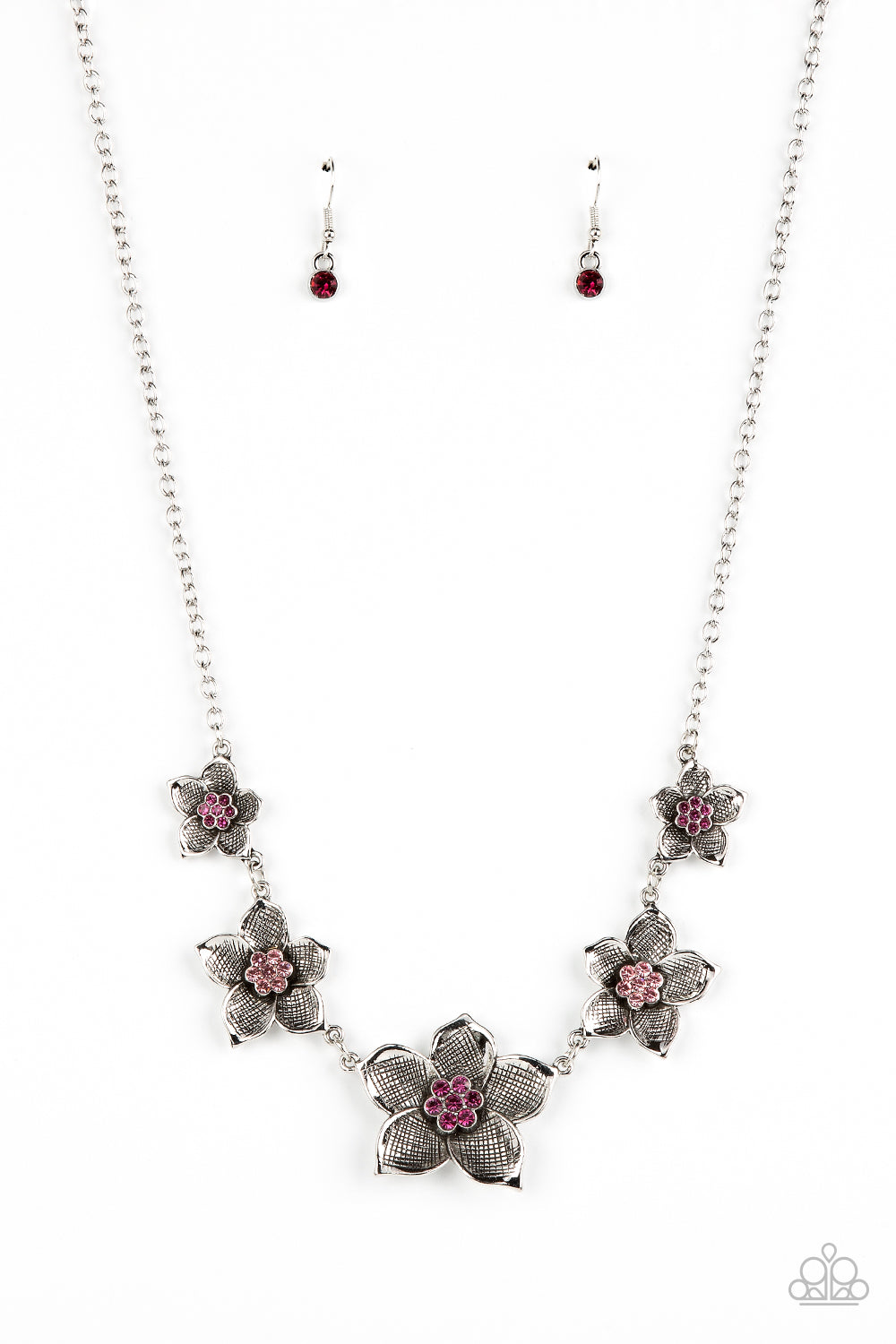 A charming collection of antiqued silver flowers in diminishing sizes delicately link across the collar. The detailed petals are etched in antiqued silver and fan out from lovely pink rhinestone centers resulting in a blissful enchantment. Features an adjustable clasp closure. 