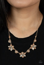 Load image into Gallery viewer, Infused with solitaire pearls, dainty clusters of bubbly champagne colored pearls and glassy white marquise style rhinestones delicately gather into clustered frames below the collar for an elegantly timeless finish. Features an adjustable clasp closure.
