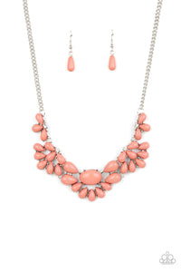 Teardrop Pale Rosette beads fan out from the bottoms of solitaire white rhinestones as they link below the collar, creating whimsically stacked frames. Featuring an oval center, oversized teardrop beads flare out from the centermost frame for a flirtatiously floral finish. Features an adjustable clasp closure. 