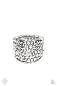 Brimming from edge to edge with a studded texture reminiscent of cobblestone, a wide silver band is bordered in dainty studs resulting in a free-spirited fashion atop the finger. Features a stretchy band for a flexible fit.  Sold as one individual ring.  Fashion Fix New Kit