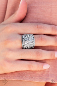 Brimming from edge to edge with a studded texture reminiscent of cobblestone, a wide silver band is bordered in dainty studs resulting in a free-spirited fashion atop the finger. Features a stretchy band for a flexible fit.  Sold as one individual ring.  Fashion Fix New Kit
