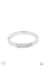 Load image into Gallery viewer, Stacked layers of brilliant white rhinestones give way to double layers of sleek silver frames that feature a subtle wave, creating a dramatically modern design around the wrist. Features a hinged closure.  Sold as one individual bracelet.
