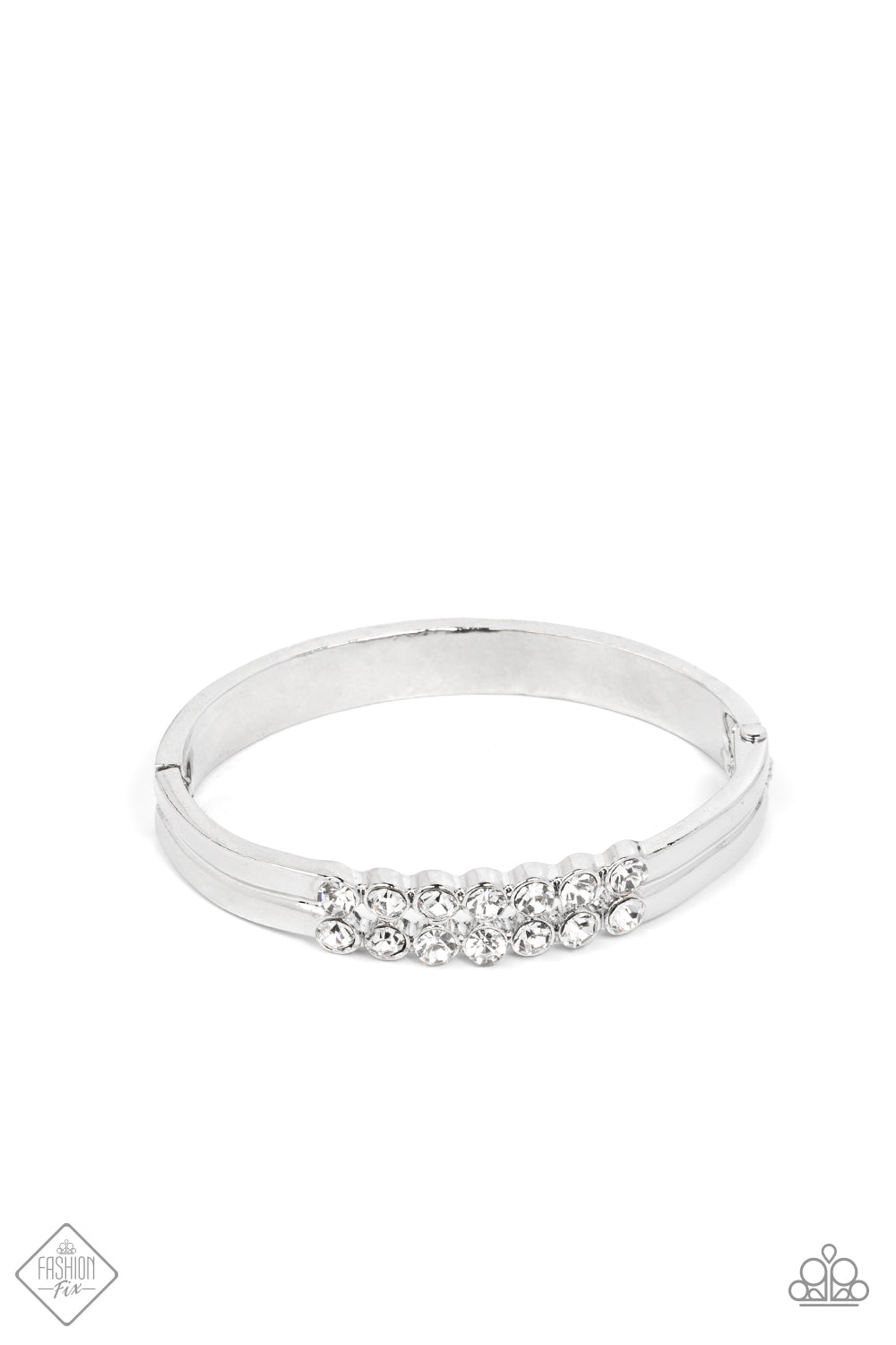 Stacked layers of brilliant white rhinestones give way to double layers of sleek silver frames that feature a subtle wave, creating a dramatically modern design around the wrist. Features a hinged closure.  Sold as one individual bracelet.