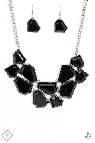 A collection of sleek black defaced beads are encased in studded silver frames which link together across the collar. The irregular-shaped designs, suspended from silver chains, make a dynamically striking statement. Features an adjustable clasp closure.  Sold as one individual necklace. Includes one pair of matching earrings.  New Kit Fashion Fix