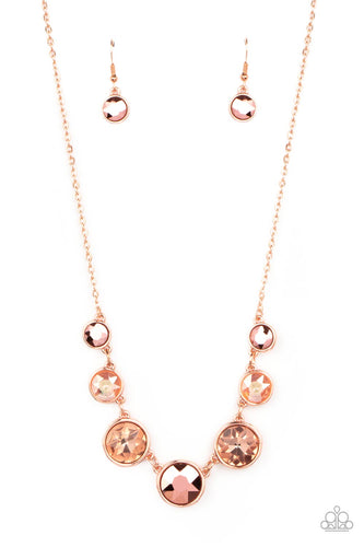 Encased in shiny copper frames, a glitzy collection of coppery aurum, coppery peach, and crackly peach gems gradually increase in size as they link below the collar for a flawless finish. Features an adjustable clasp closure. 