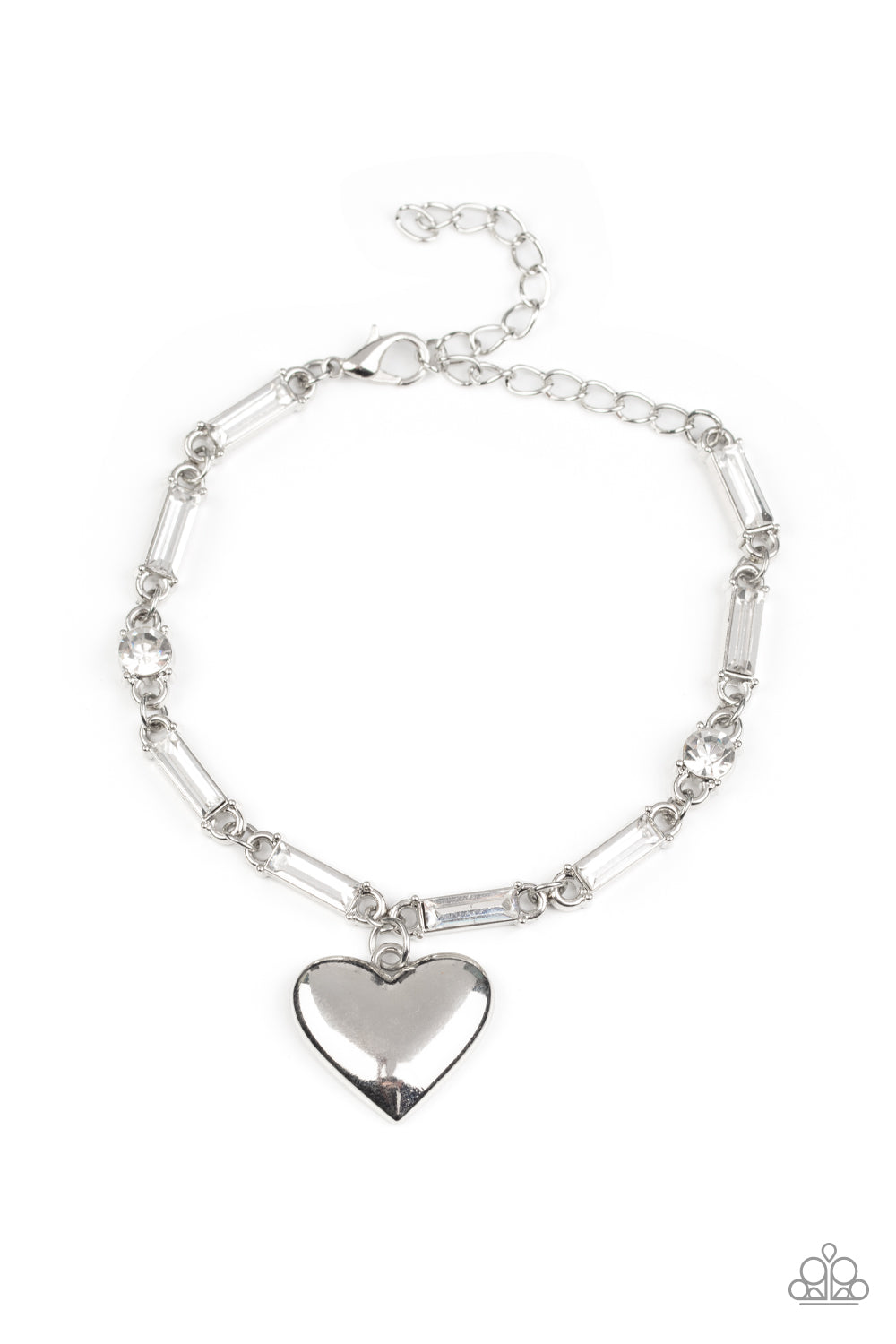 Encased in sleek silver fittings, round and emerald cut rhinestones delicately link into a sparkly chain around the wrist. A shiny silver heart charm swings from the glittery compilation, adding a flirtatious shimmer. Features an adjustable clasp closure.