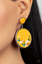 Load image into Gallery viewer, A small yellow leather disc, encased in a simple silver frame, anchors a larger yellow circle that is adorned with fanciful embroidered flowers creating a whimsical lure. Earring attaches to a standard post fitting.
