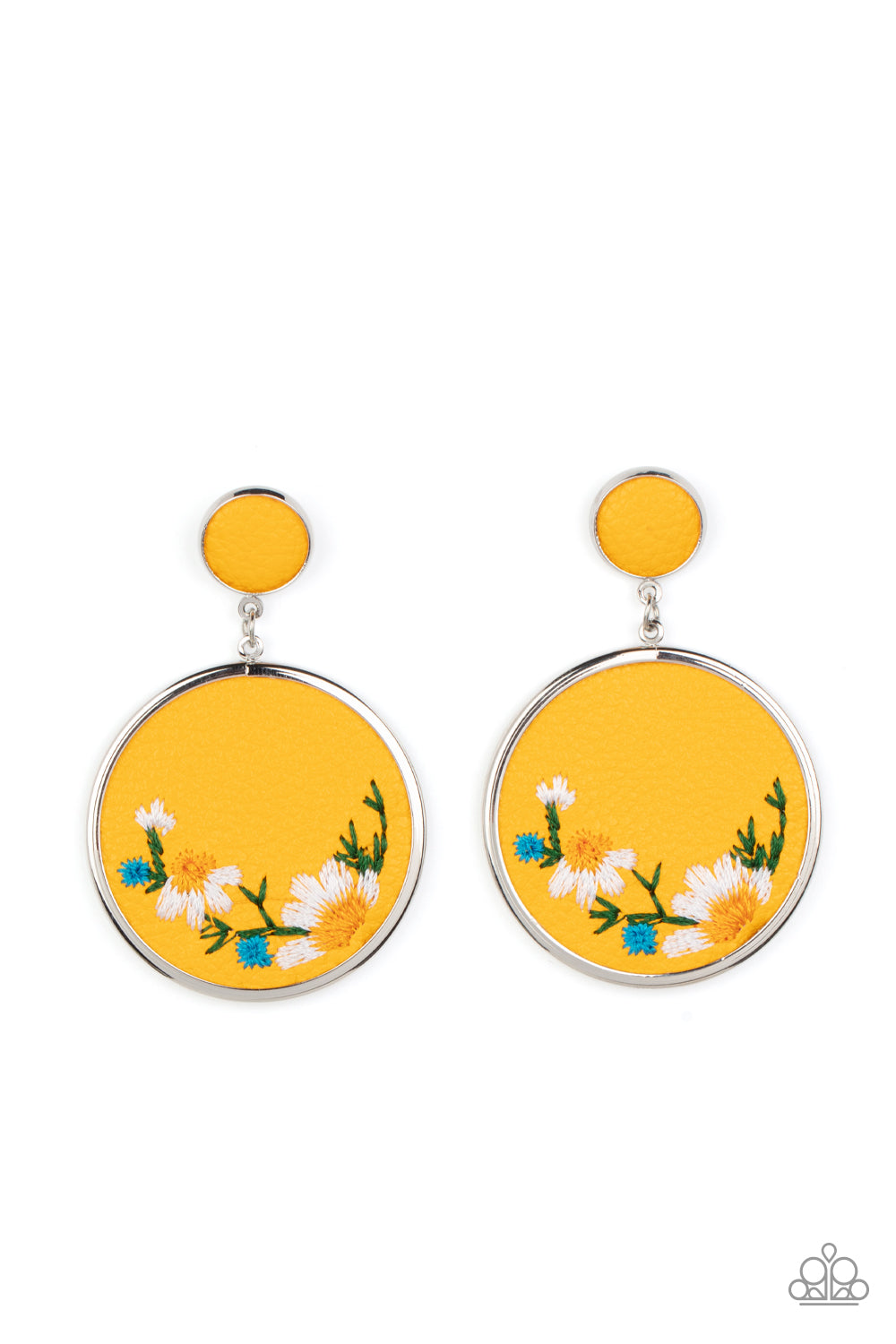 A small yellow leather disc, encased in a simple silver frame, anchors a larger yellow circle that is adorned with fanciful embroidered flowers creating a whimsical lure. Earring attaches to a standard post fitting.