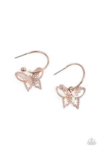 An airy rose gold butterfly charm glides along a dainty rose gold hoop, creating a fluttering fashion. Earring attaches to a post fitting. Hoop measures approximately 3/4