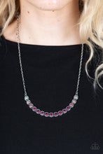 Load image into Gallery viewer, Encased in studded silver fittings, a glittery ombré of pink rhinestones delicately bows below the collar, creating an enchanting pop of color. Features an adjustable clasp closure.
