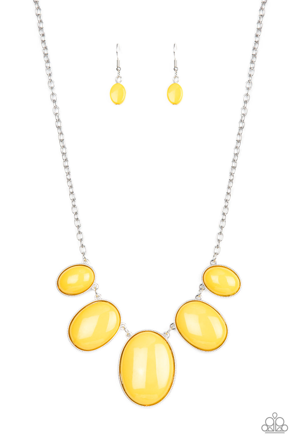 Encased in studded silver fittings, oversized oval mustard yellow frames gradually increase in size as they link below the collar for a dramatic pop of color. Features an adjustable clasp closure.