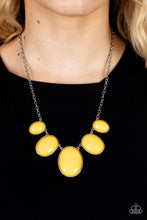 Load image into Gallery viewer, Encased in studded silver fittings, oversized oval mustard yellow frames gradually increase in size as they link below the collar for a dramatic pop of color. Features an adjustable clasp closure.
