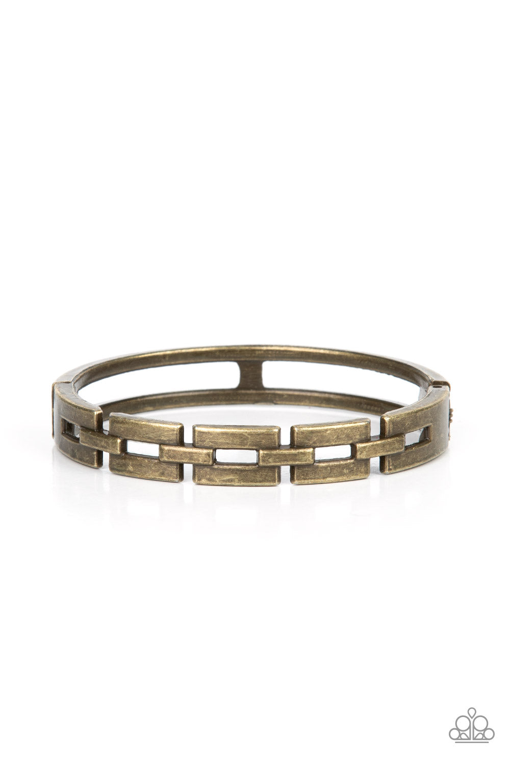 An antiqued row of rectangular brass links boldly interlock across the top of the wrist, coalescing into an edgy bangle-like bracelet. Features a hinged closure.