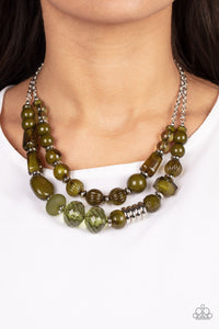 Varying in shape, size, and opacity, a refreshing collection of Olive Branch acrylic and crystal-like beads join silver discs along invisible wires that flawlessly layer below the collar for an earthy pop of color. Features an adjustable clasp closure.