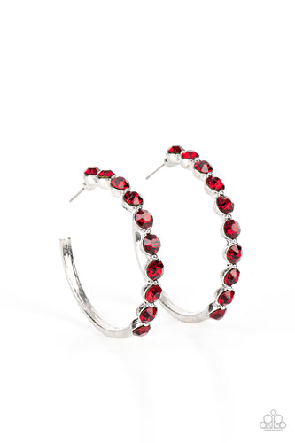 The front of a bold silver hoop is encrusted in fiery red rhinestones, creating a glamorous pop of sparkle. Earring attaches to a standard post fitting. Hoop measures approximately 1 3/4