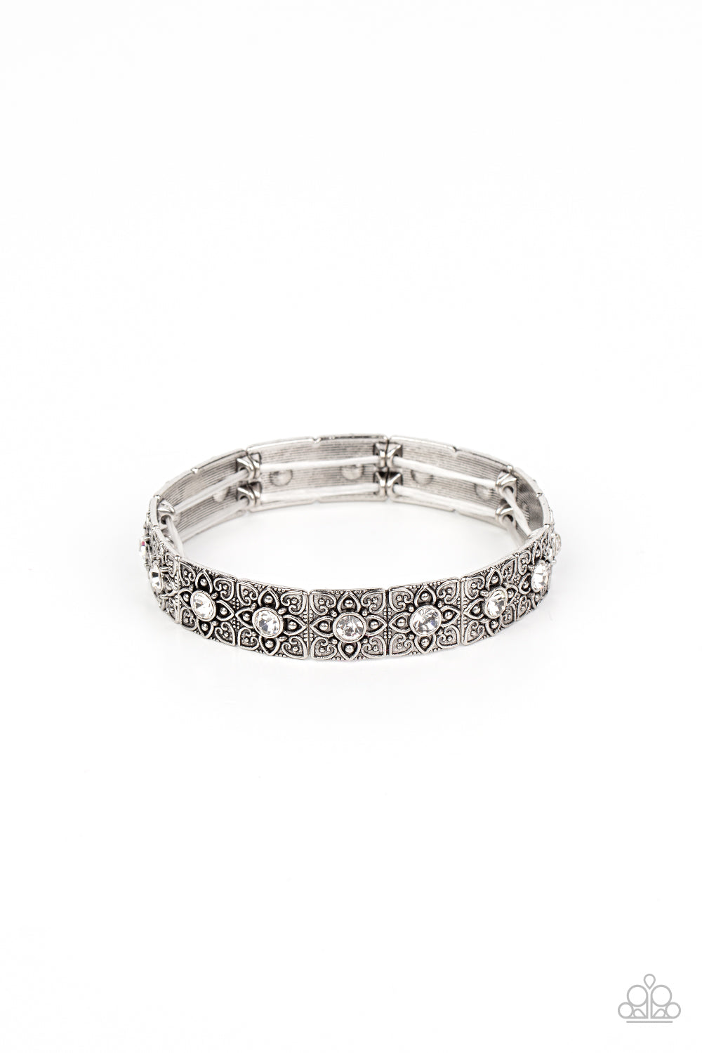 Dotted with dainty white rhinestone centers, floral filigree embossed silver frames are threaded along stretchy bands around the wrist for a romantic pop of color.