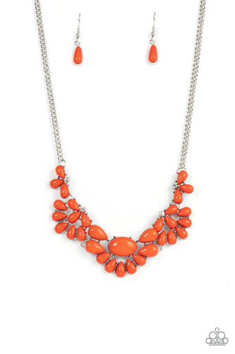 Teardrop burnt orange beads fan out from the bottoms of solitaire white rhinestones as they link below the collar, creating whimsically stacked frames. Featuring an oval center, oversized teardrop beads flare out from the centermost frame for a flirtatiously floral finish. Features an adjustable clasp closure. 