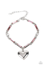 Load image into Gallery viewer, Encased in sleek silver fittings, classic white rhinestones and emerald cut pink rhinestones delicately link into a sparkly chain around the wrist. A shiny silver heart charm swings from the glittery compilation, adding a flirtatious shimmer. Features an adjustable clasp closure.
