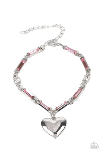 Encased in sleek silver fittings, classic white rhinestones and emerald cut pink rhinestones delicately link into a sparkly chain around the wrist. A shiny silver heart charm swings from the glittery compilation, adding a flirtatious shimmer. Features an adjustable clasp closure.