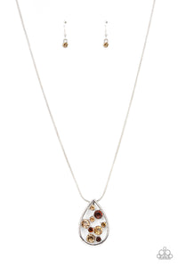 A bubbly collection of classic and golden topaz rhinestones coalesce inside an airy silver teardrop, resulting in an effervescently elegant pendant at the bottom of a rounded silver snake chain. Features an adjustable clasp closure. 