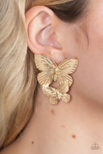 Load image into Gallery viewer, Veined with lifelike textures, a pair of golden butterflies flutters from the ear for a whimsical fashion. Earring attaches to a standard post fitting.
