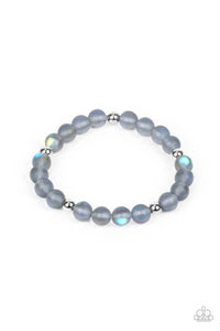 Infused with silver accents, a dreamy collection of iridescent rainbow specked beads are threaded along a stretchy band around the wrist for an enchanting glow.  Sold as one individual bracelet.
