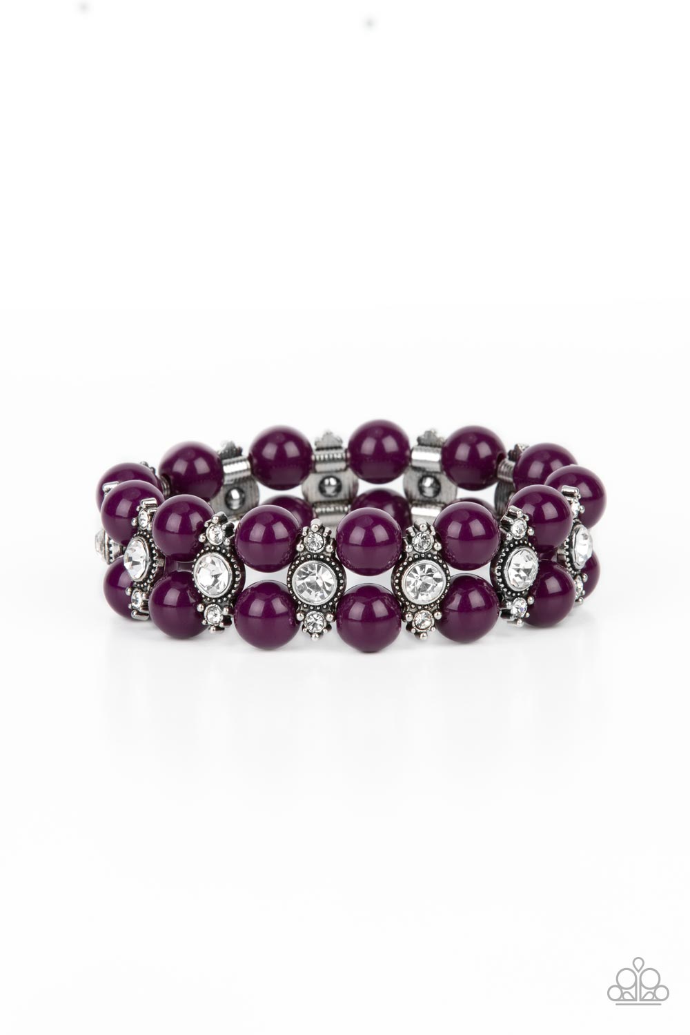 Stacked rows of bubbly plum beads alternate with white rhinestone encrusted silver frames along stretchy bands, creating a timeless pop of color around the wrist. 