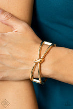 Load image into Gallery viewer, Striking gold bars delicately knot at the top and bottom of the wrist, resulting in a sultry bangle-like bracelet that&#39;s brushed in high-sheen shimmer. Features a hinged closure.  Sold as one individual bracelet.  New Kit Fashion Fix
