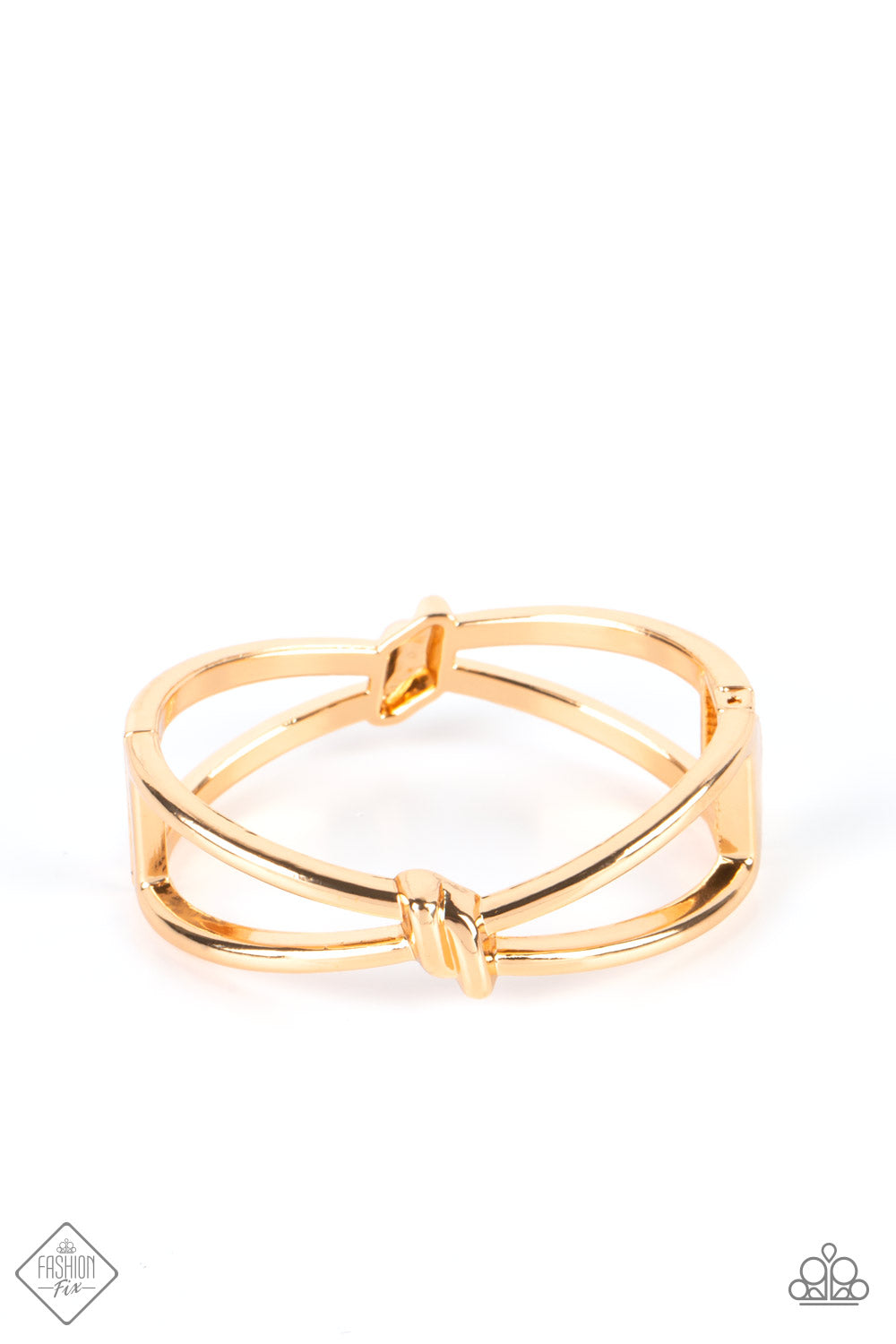 Striking gold bars delicately knot at the top and bottom of the wrist, resulting in a sultry bangle-like bracelet that's brushed in high-sheen shimmer. Features a hinged closure.  Sold as one individual bracelet.  New Kit Fashion Fix