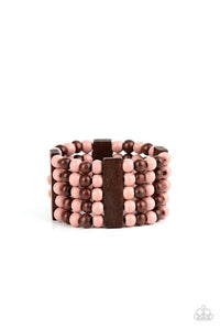 Colorful layers of brown and Pale Rosette wooden beads are threaded along stretchy bands between brown wooden bars creating stacks of subtle bliss around the wrist.