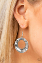 Load image into Gallery viewer, Featuring a high sheen finish, a warped silver disc ripples around a studded silver center for a rustic flair. Earring attaches to a standard fishhook fitting.  Sold as one pair of earrings.  New Kit Fashion Fix
