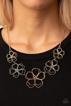 Load image into Gallery viewer, Glistening silver and gold wires delicately twist into oversized blossoms. Gradually increasing in size, the 3D frames elegantly pop beneath the collar. Features an adjustable clasp closure.
