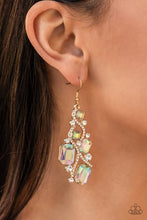 Load image into Gallery viewer, Golden ribbons of glassy white rhinestones whirl around a chandelier of classic round white rhinestones and emerald and square cut iridescent rhinestones, coalescing into an effervescent elegance. Earring attaches to a standard fishhook fitting.  Sold as one pair of earrings.
