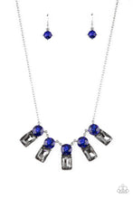 Load image into Gallery viewer, A sparkly row of oversized blue gems regally sit atop emerald cut smoky rhinestone bases as they delicately link along a dainty silver chain below the collar, resulting in a royal glamorous centerpiece. Features an adjustable clasp closure.
