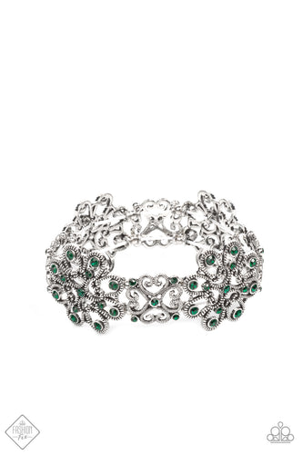 Dainty emerald rhinestones scatter across the fronts of airy medallions fashioned from whimsical heart-shaped filigree. The splendid frames alternate along stretchy bands resulting in a regally refined design that wraps around the wrist.  Sold as one individual bracelet.  Fashion Fix