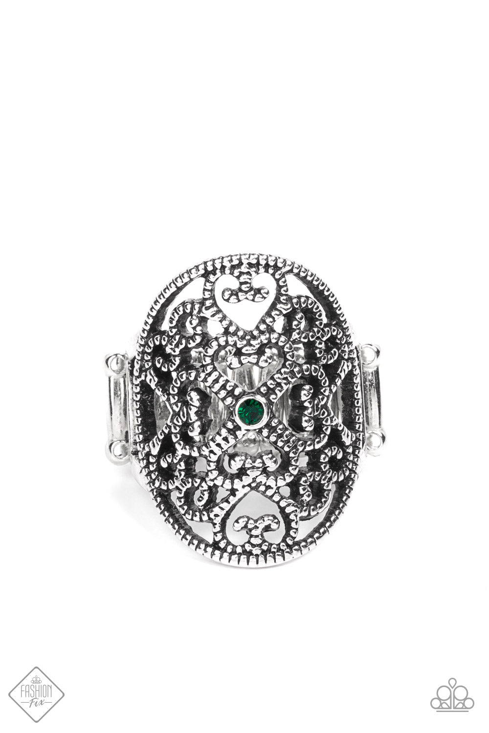 Whimsical heart-shaped studded filigree replays in a fanciful fashion inside a daintily studded antiqued silver frame. A single petite emerald green rhinestone rests in the center adding a splash of charismatic color atop the finger. Features a stretchy band for a flexible fit.  Sold as one individual ring.  Fashion Fix