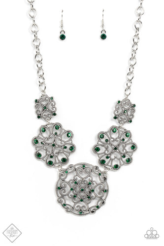 Exquisite heart motifs dotted with dainty emerald rhinestones coalesce into airy medallions that link to a modest silver chain. The varying sizes and permeating patterns of the medallions create a romantically glamorous finish across the collar. Features an adjustable clasp closure.  Sold as one individual necklace. Includes one pair of matching earrings.  Fashion Fix