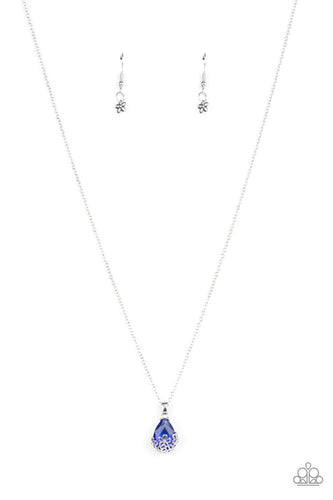 Dainty silver flowers adorn the bottom of a sparkly blue teardrop gem at the bottom of a dainty silver chain, creating a prismatic pendant below the collar. Features an adjustable clasp closure.