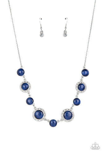 Featuring classic silver fittings or white rhinestone encrusted silver frames, a mesmerizing collection of glowing blue cat's eye stones delicately link below the collar for an ethereal pop of color. Features an adjustable clasp closure.