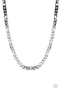 A faceted strand of oversized gunmetal curb chain drapes across the chest, resulting in an edgy centerpiece. Features an adjustable clasp closure. 
