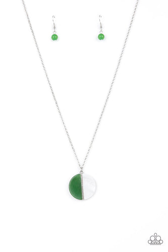 A pair of jade stone and white shell-like half moon frames adorn the front of a round silver fitting, creating a whimsical pendant below the collar. Features an adjustable clasp closure.