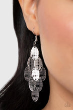 Load image into Gallery viewer, Featuring abstract crisscrossed texture, oval silver frames cascade from a metallic netted backdrop, resulting in a noise-making lure. Earring attaches to a standard fishhook fitting.
